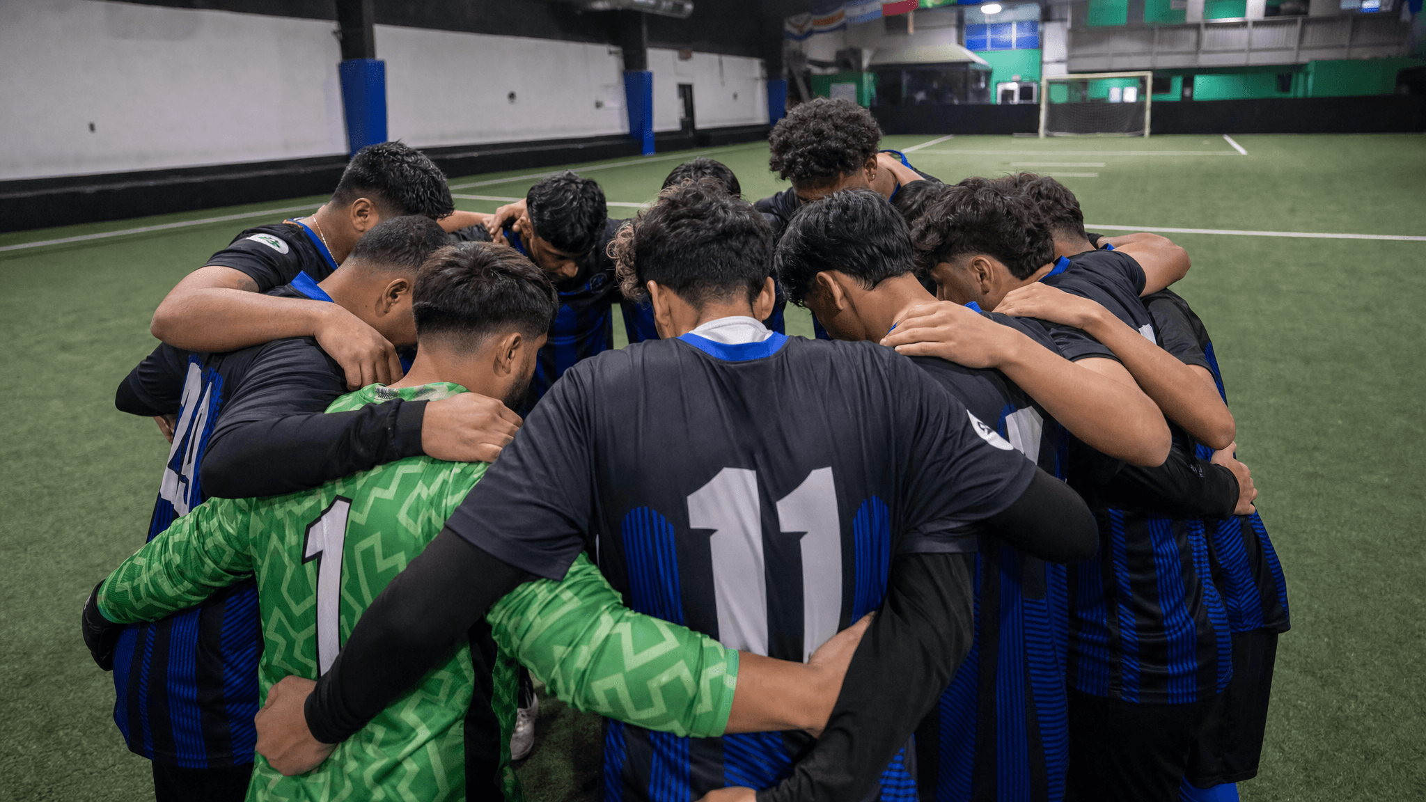 A UPlay team huddle before kickoff at the Richmond pitch